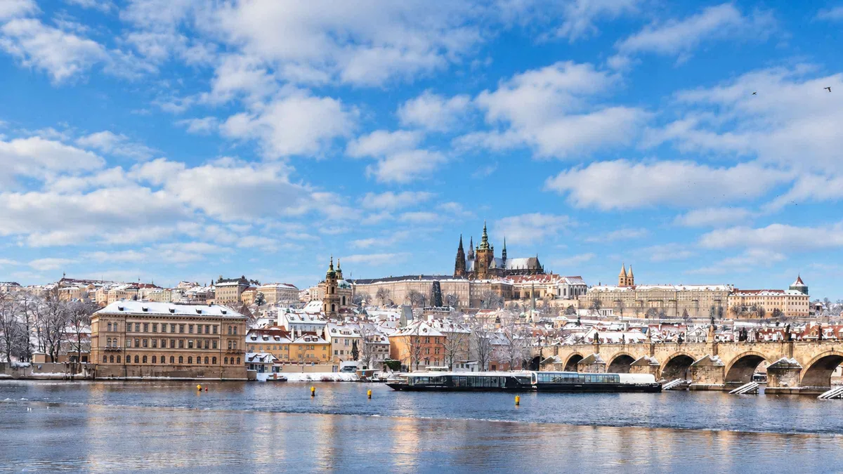 A glass-enclosed river cruise boat on the Vltava in Prague in winter